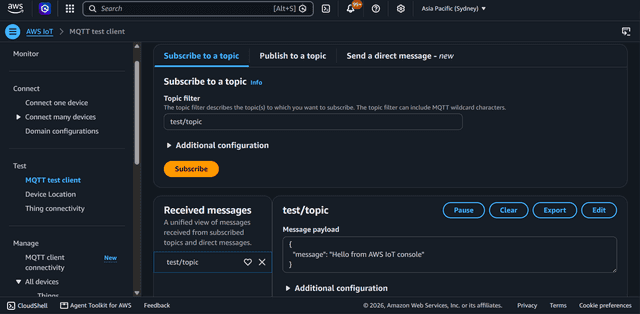 AWS IoT MQTT test client showing a subscription to test/topic with a received JSON message payload